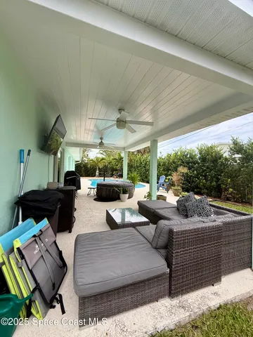 a living room with stainless steel appliances kitchen island granite countertop furniture and a view of kitchen