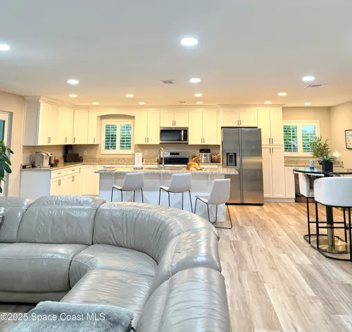 a view of hallway with wooden floor
