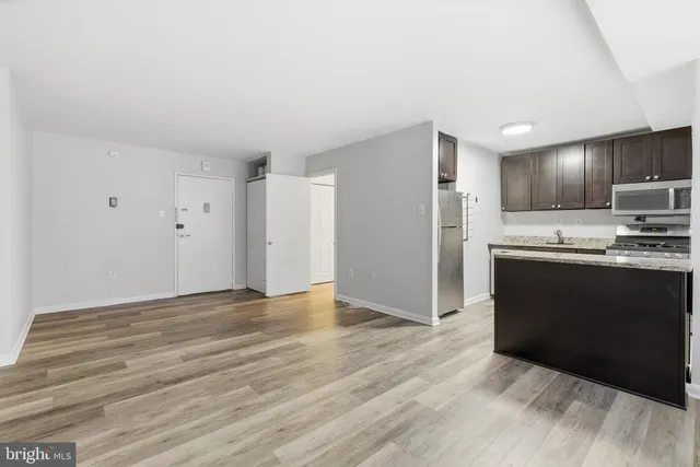 a view of kitchen with wooden floor