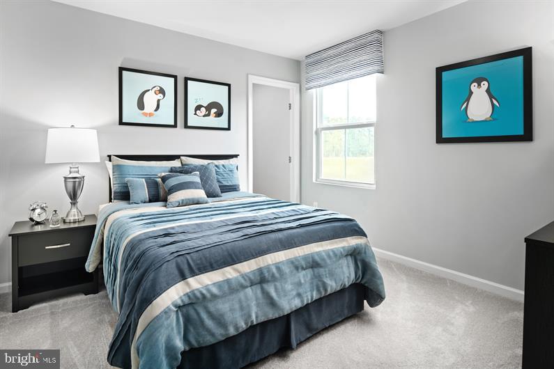 9216 Cooks Point Court, Unit 34 Lanham, MD 20706 - Photo 16 of 17 a bedroom with a bed and painting on the wall