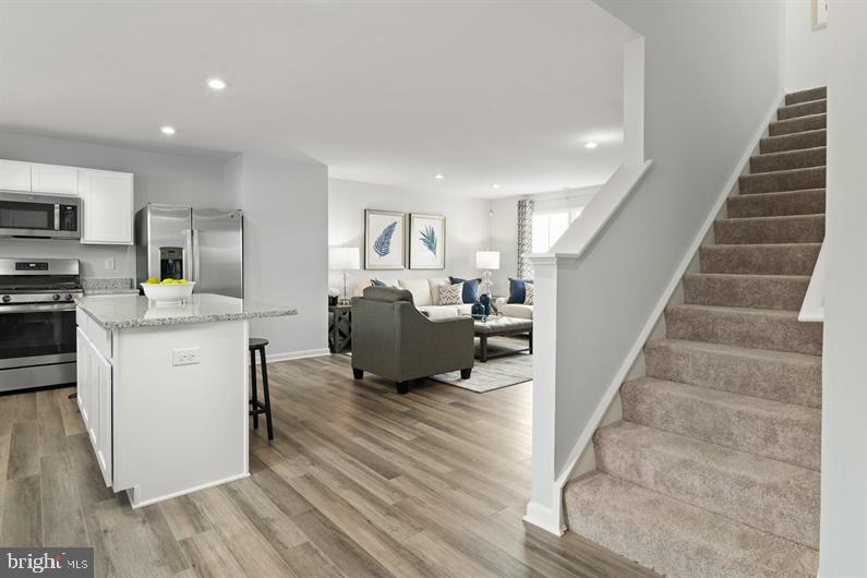 9216 Cooks Point Court, Unit 34 Lanham, MD 20706 - Photo 6 of 17 a living room with furniture and a wooden floor