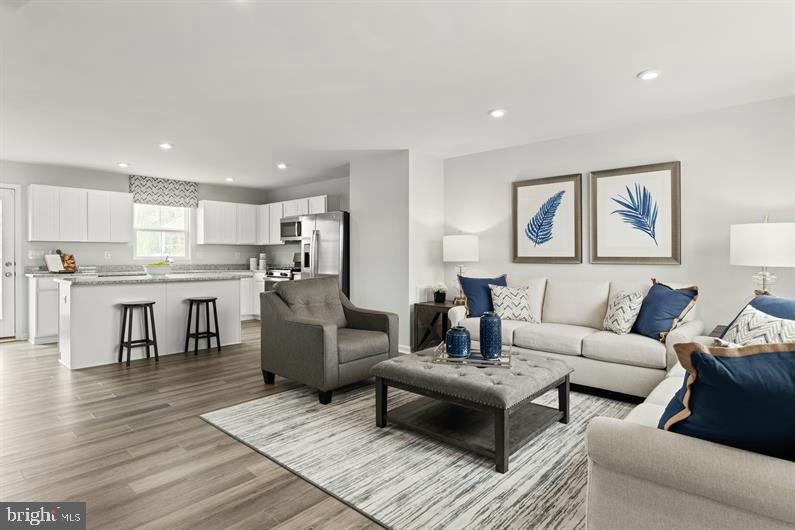 9216 Cooks Point Court, Unit 34 Lanham, MD 20706 - Photo 7 of 17 a living room with furniture and kitchen view