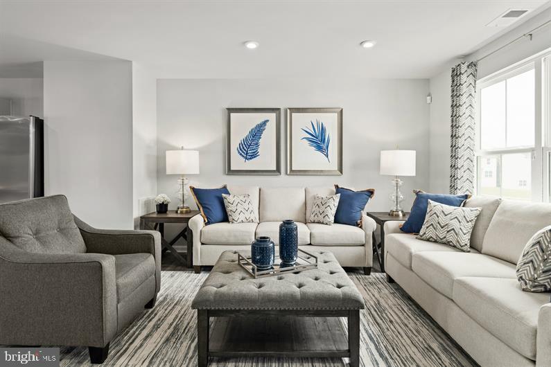 9216 Cooks Point Court, Unit 34 Lanham, MD 20706 - Photo 8 of 17 a living room with furniture and a large window