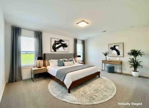 a bed room with a bed and a couch