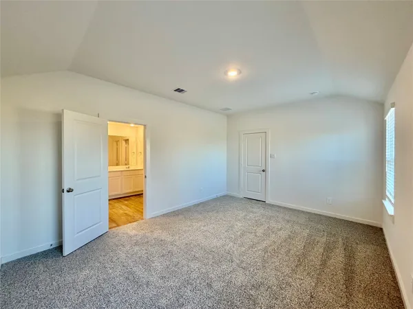 an empty room with a empty space and windows