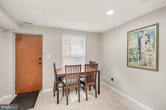 a view of a livingroom with furniture and a window
