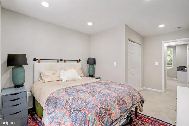 a bedroom with a bed and closet