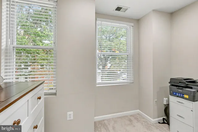 a room that has a window and a sink in it