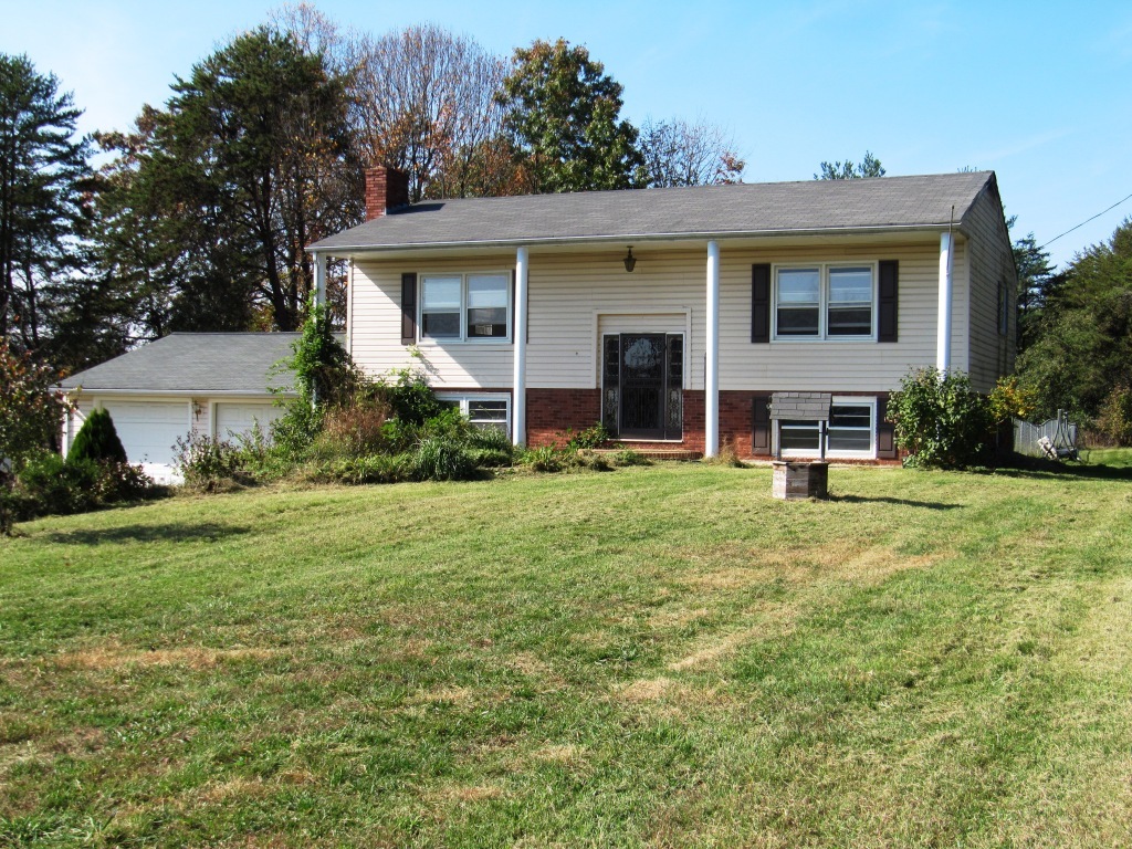 2435 Morgans Mill Road Goodview, VA 24095 - Photo 1 of 6 front view of a house with a yard