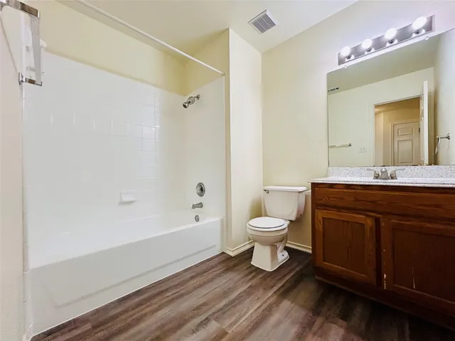 a bathroom with a sink a toilet and a bathtub