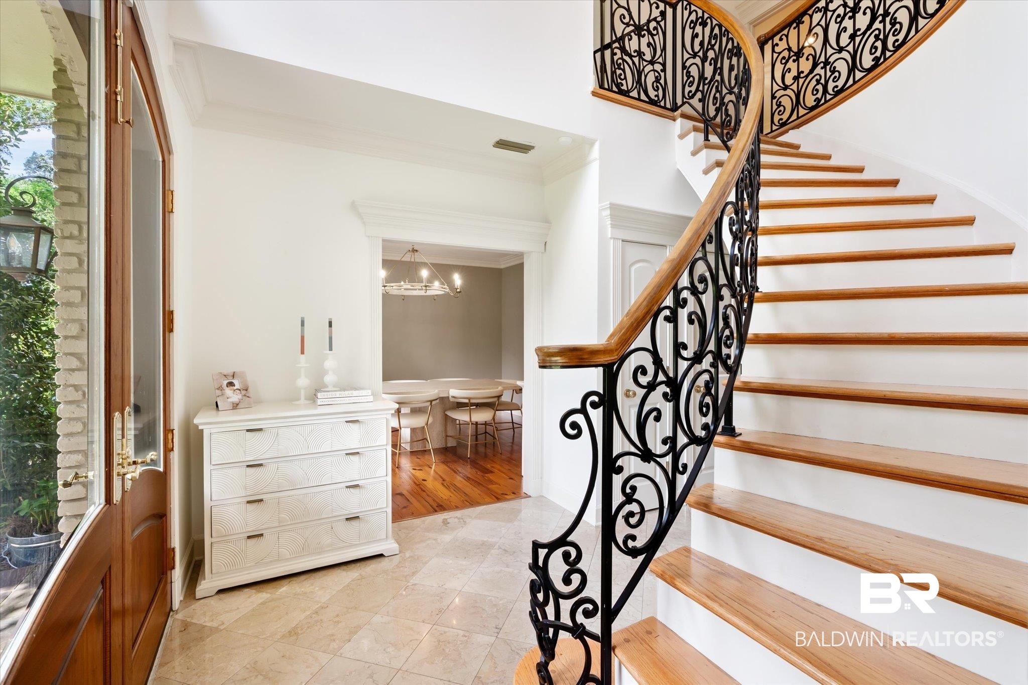 11 Drury Lane Mobile, AL 36608 - Photo 2 of 34 Staircase with a notable chandelier, light wood-type flooring, and ornamental molding