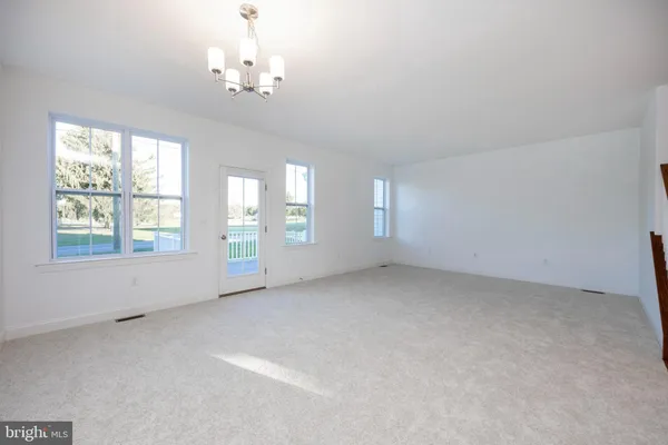 a kitchen with a stove and a refrigerator