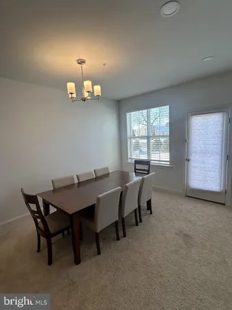 a view of a house with a yard and deck