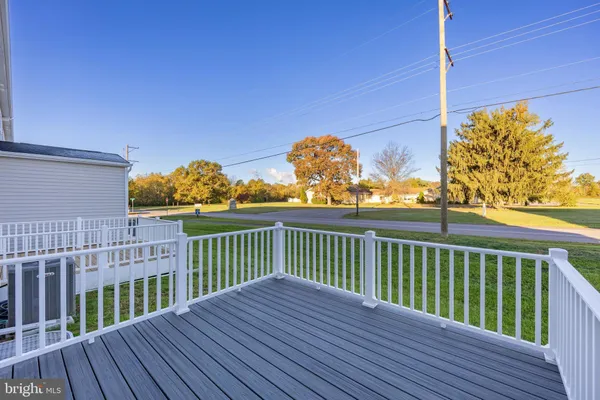 a view of a house with wooden fence