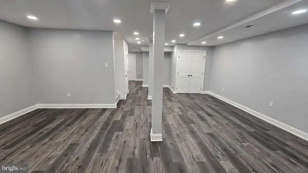 a view of room with wooden floor