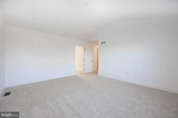 a bathroom with a shower and a sink
