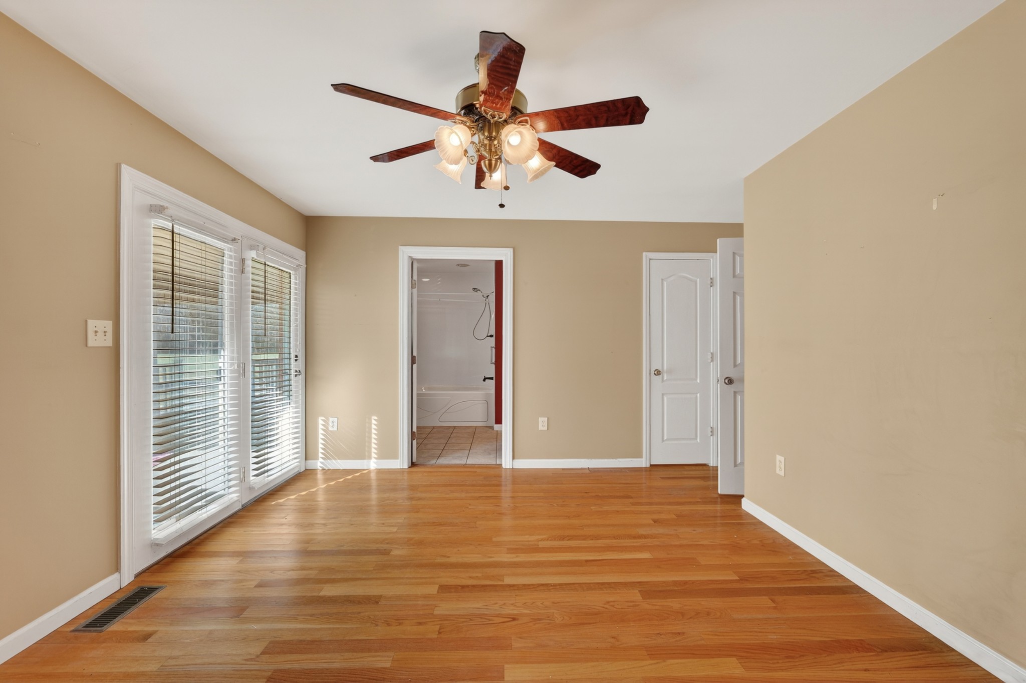44 Old Camargo Road Fayetteville, TN 37334 - Photo 15 of 38 a view of empty room with wooden floor and fan