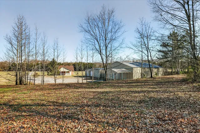 a big house with trees in front of it