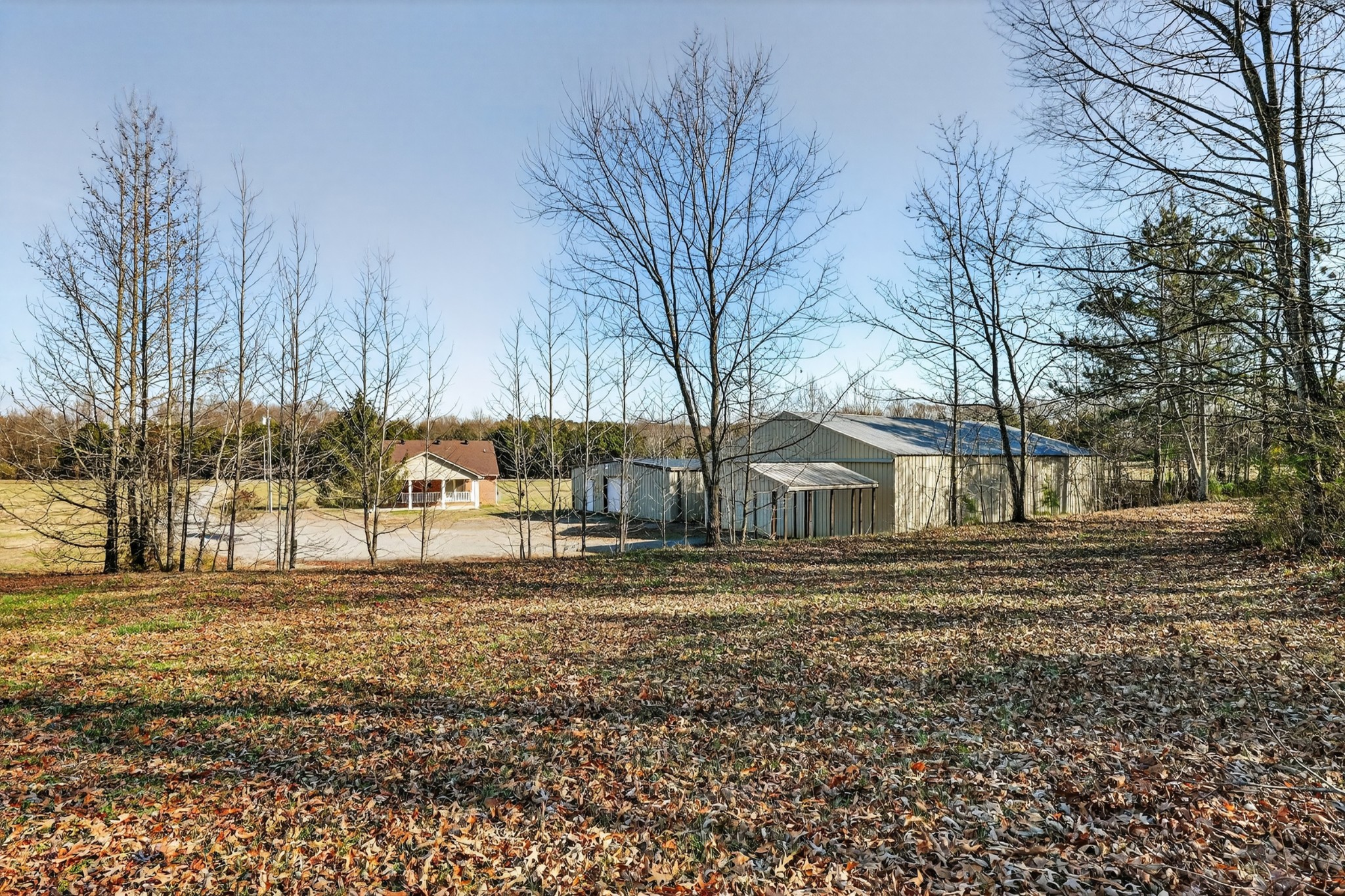44 Old Camargo Road Fayetteville, TN 37334 - Photo 23 of 38 a big house with trees in front of it