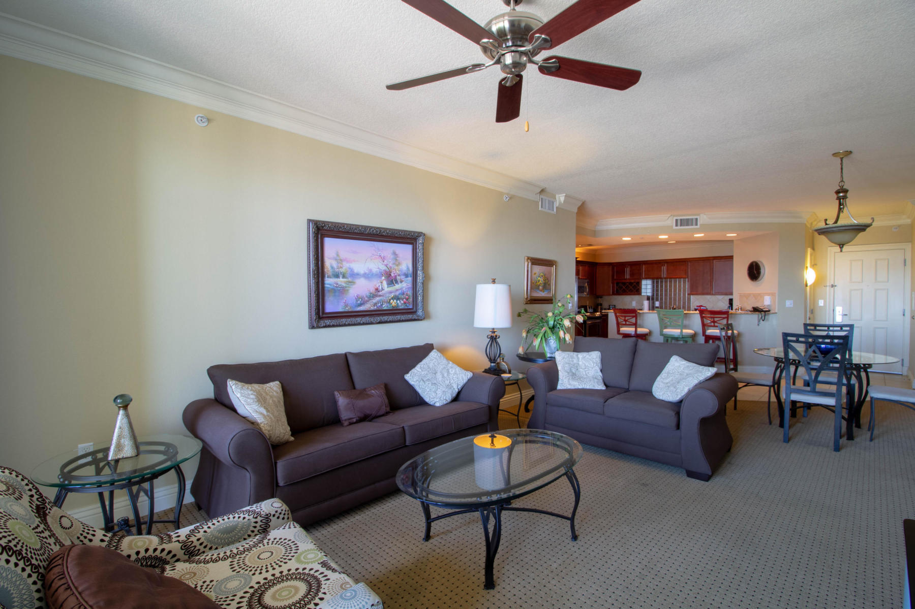 10 Harbor Boulevard, Unit W528 Destin, FL 32541 - Photo 2 of 25 a living room with furniture and a ceiling fan