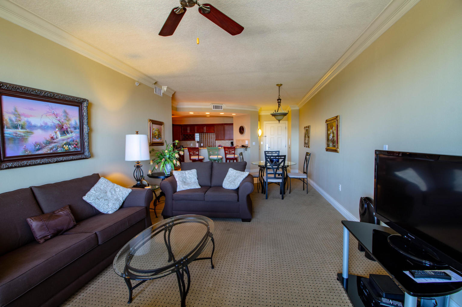 10 Harbor Boulevard, Unit W528 Destin, FL 32541 - Photo 3 of 25 a living room with furniture and a flat screen tv