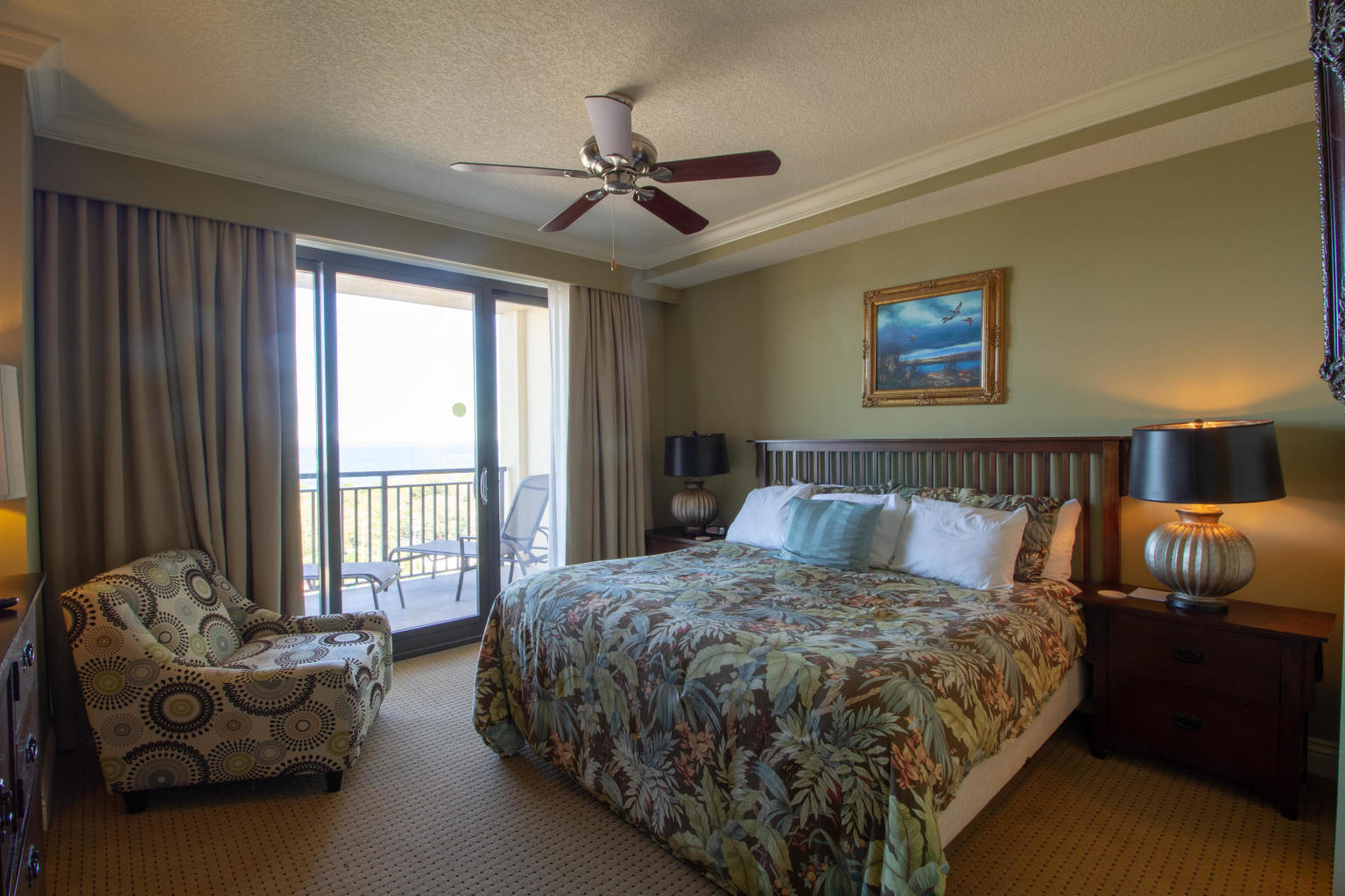 10 Harbor Boulevard, Unit W528 Destin, FL 32541 - Photo 7 of 25 a bed sitting in a spacious bedroom next to a window