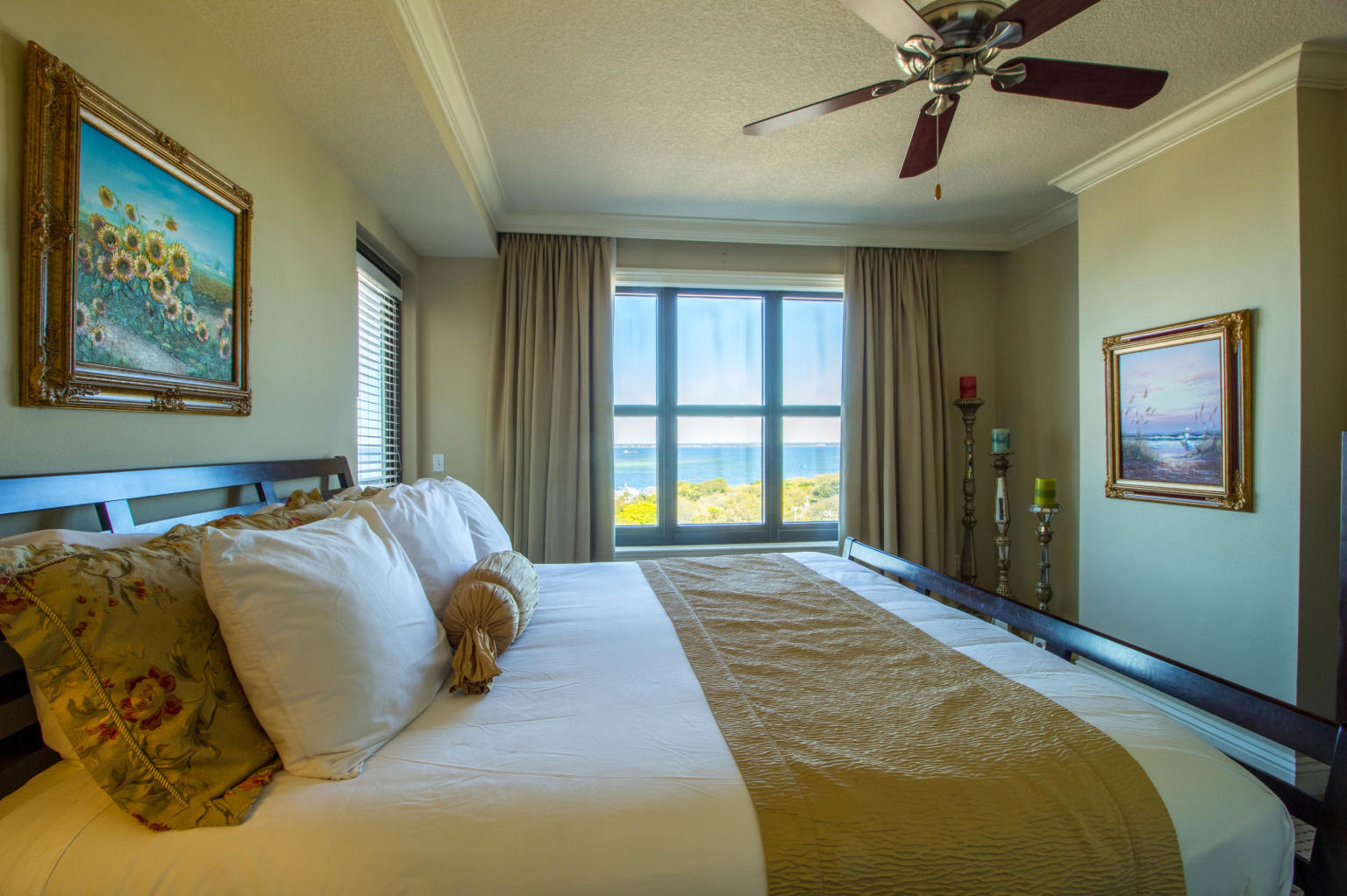 10 Harbor Boulevard, Unit W528 Destin, FL 32541 - Photo 9 of 25 a bed sitting in a bedroom next to a window