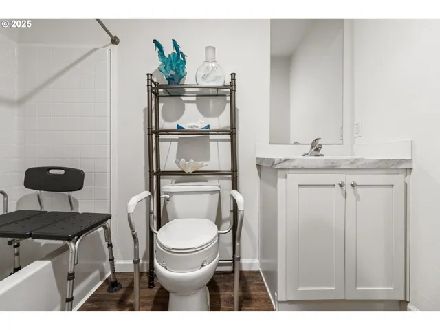 a living room with furniture and a dresser