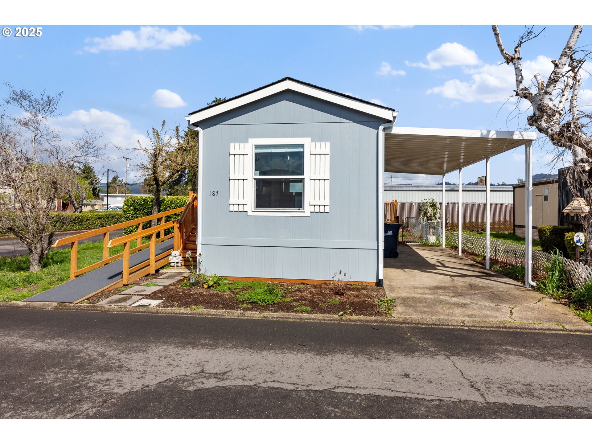 5335 Main Street, Unit 187 Springfield, OR 97478 - Photo 27 of 39 a front view of a house with a yard