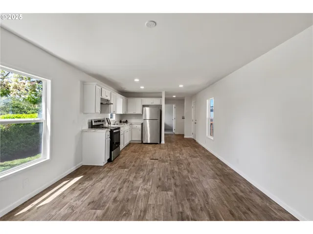 a view of kitchen with wooden floor