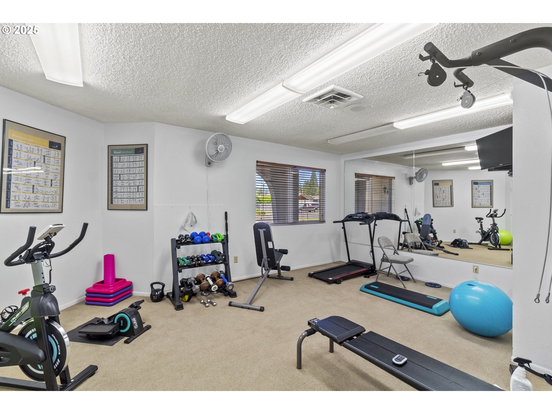 5335 Main Street, Unit 187 Springfield, OR 97478 - Photo 37 of 39 a room with gym equipment and a window