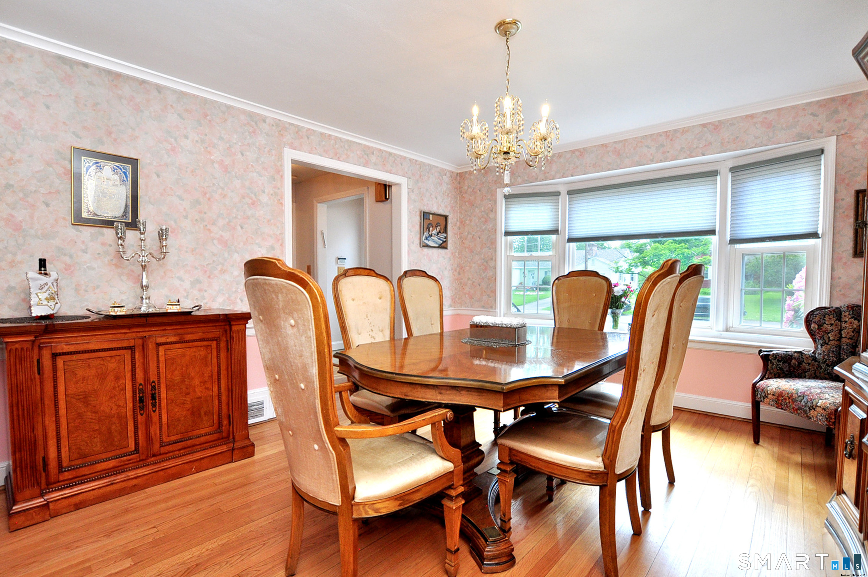 16 Miamis Road West Hartford, CT 06117 - Photo 10 of 39 Spacious dining room with hard wood floors and bow window offering plenty of sunshine!