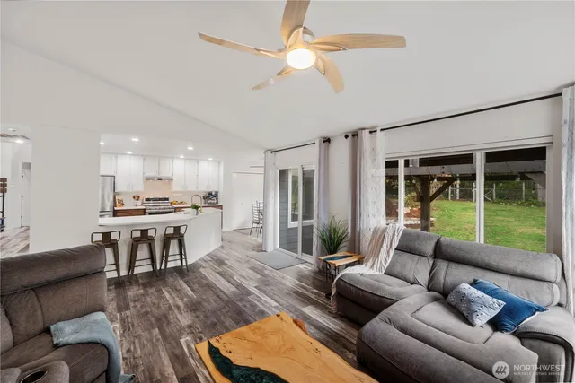 a living room with furniture and a large window