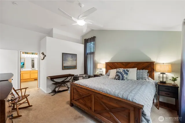 a bedroom with a bed and a table in it