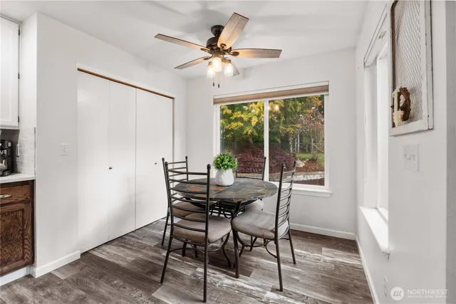 a view of a dining room with furniture window and outside view