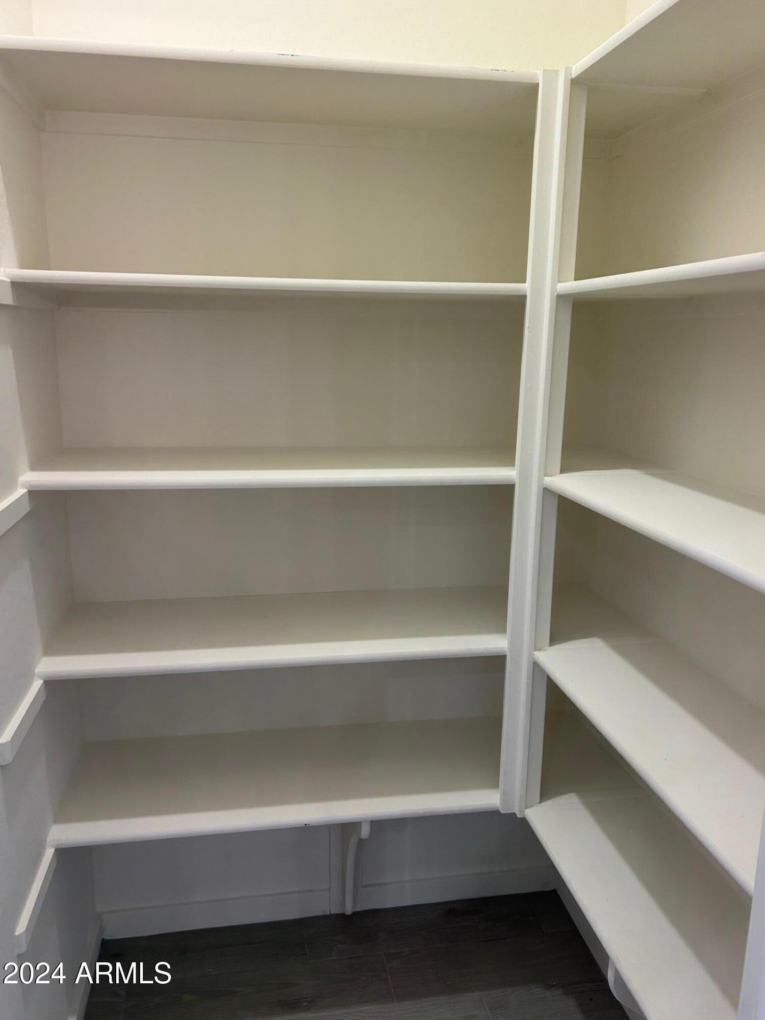 20520 North Candlelight Road Maricopa, AZ 85138 - Photo 7 of 18 a view of walk in closet with empty racks