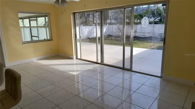 a spacious bathroom with a granite countertop sink a toilet and vanity