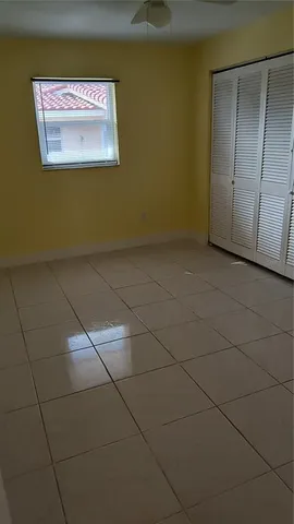 a bathroom with a granite countertop sink a mirror and a vanity