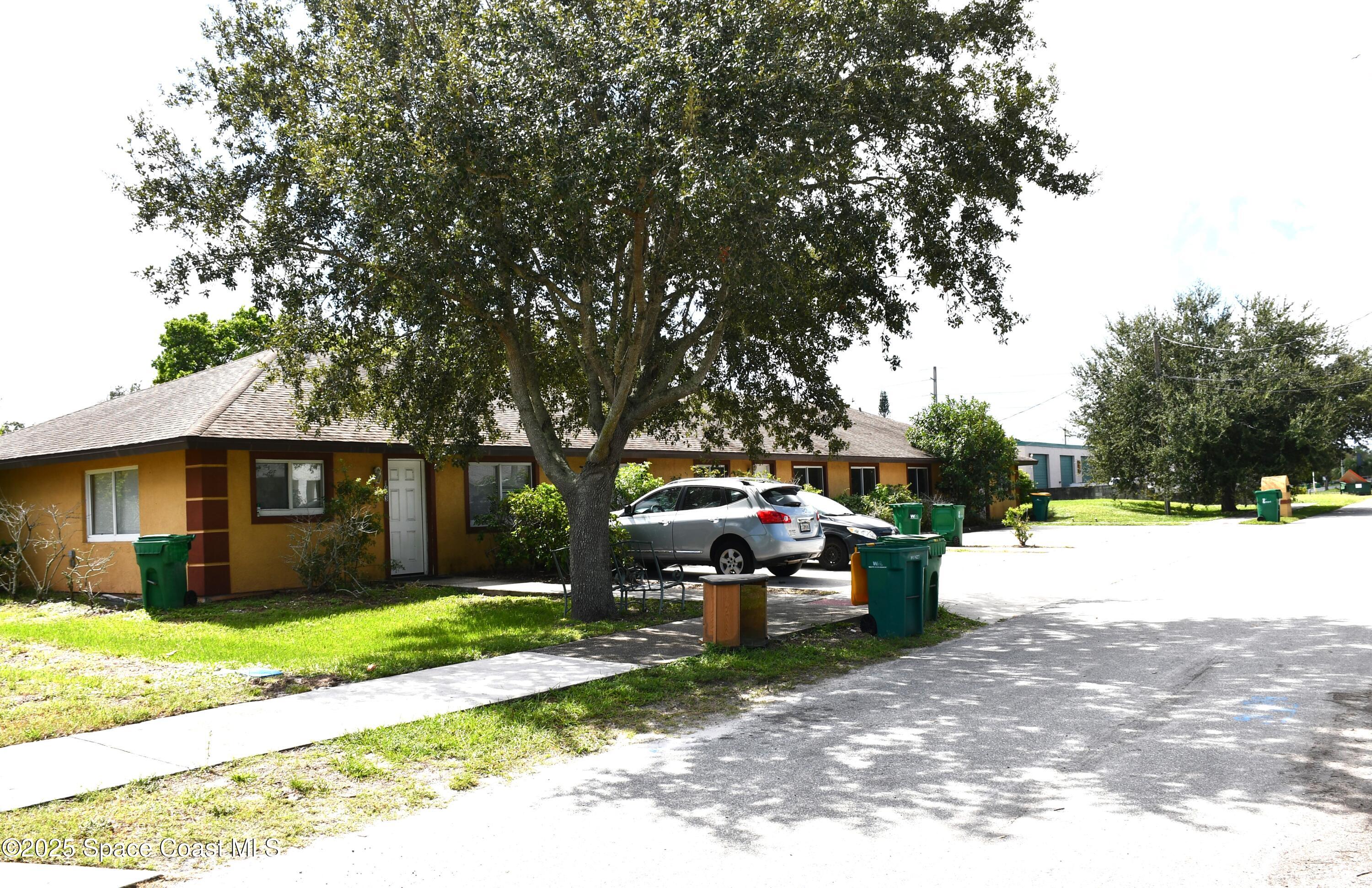 1523 Furnari Street Cocoa, FL 32922 - Photo 2 of 8 a view of a house with backyard and a tree