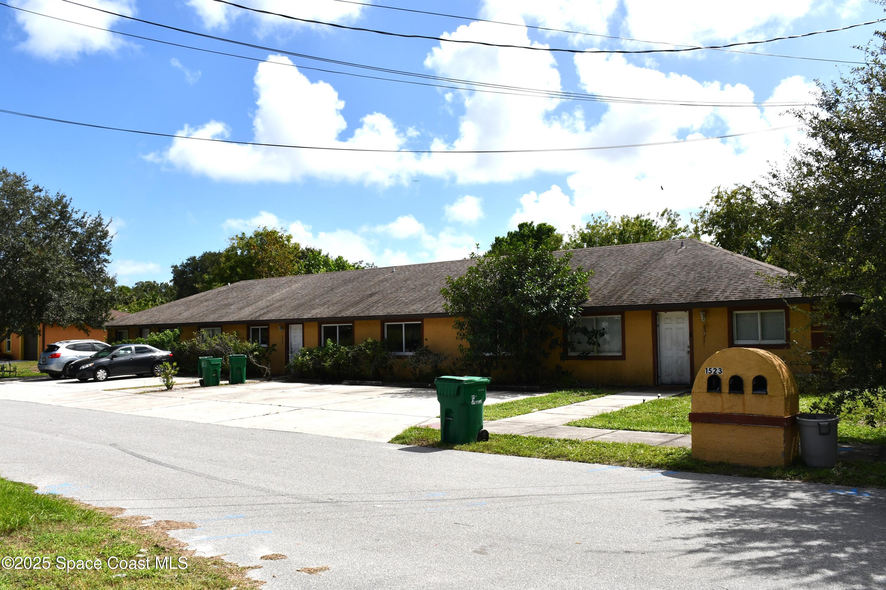 1523 Furnari Street Cocoa, FL 32922 - Photo 5 of 8 a view of a house with a yard