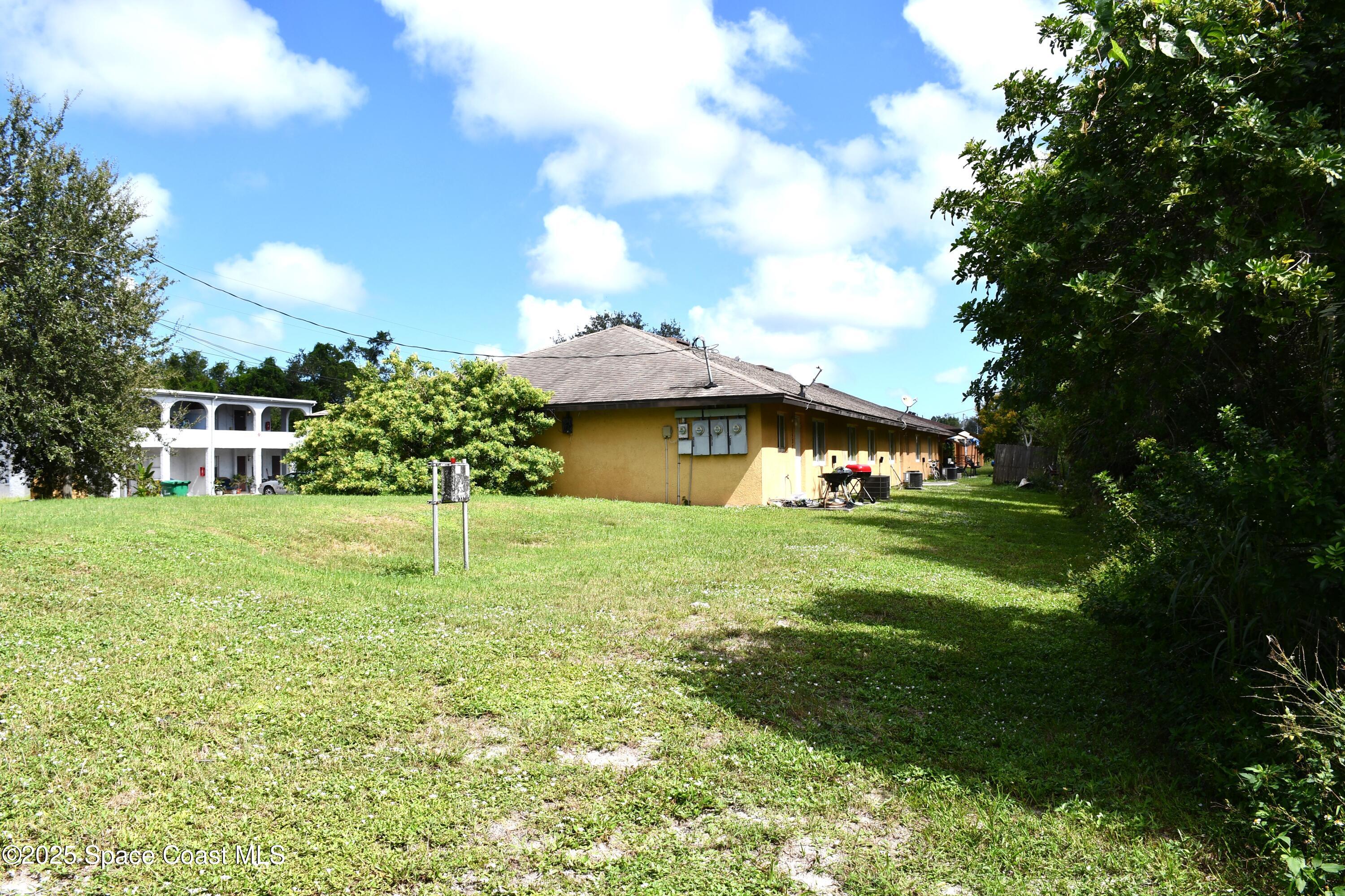 1523 Furnari Street Cocoa, FL 32922 - Photo 7 of 8 a view of a house with a yard