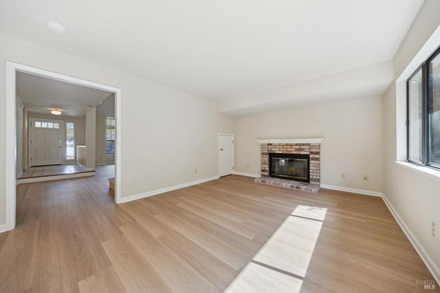 a kitchen with a refrigerator stove and cabinets