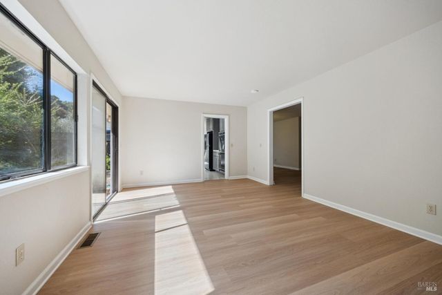 a kitchen with stainless steel appliances a refrigerator sink and cabinets
