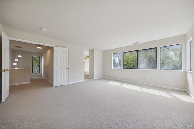 a view of an empty room and entryway