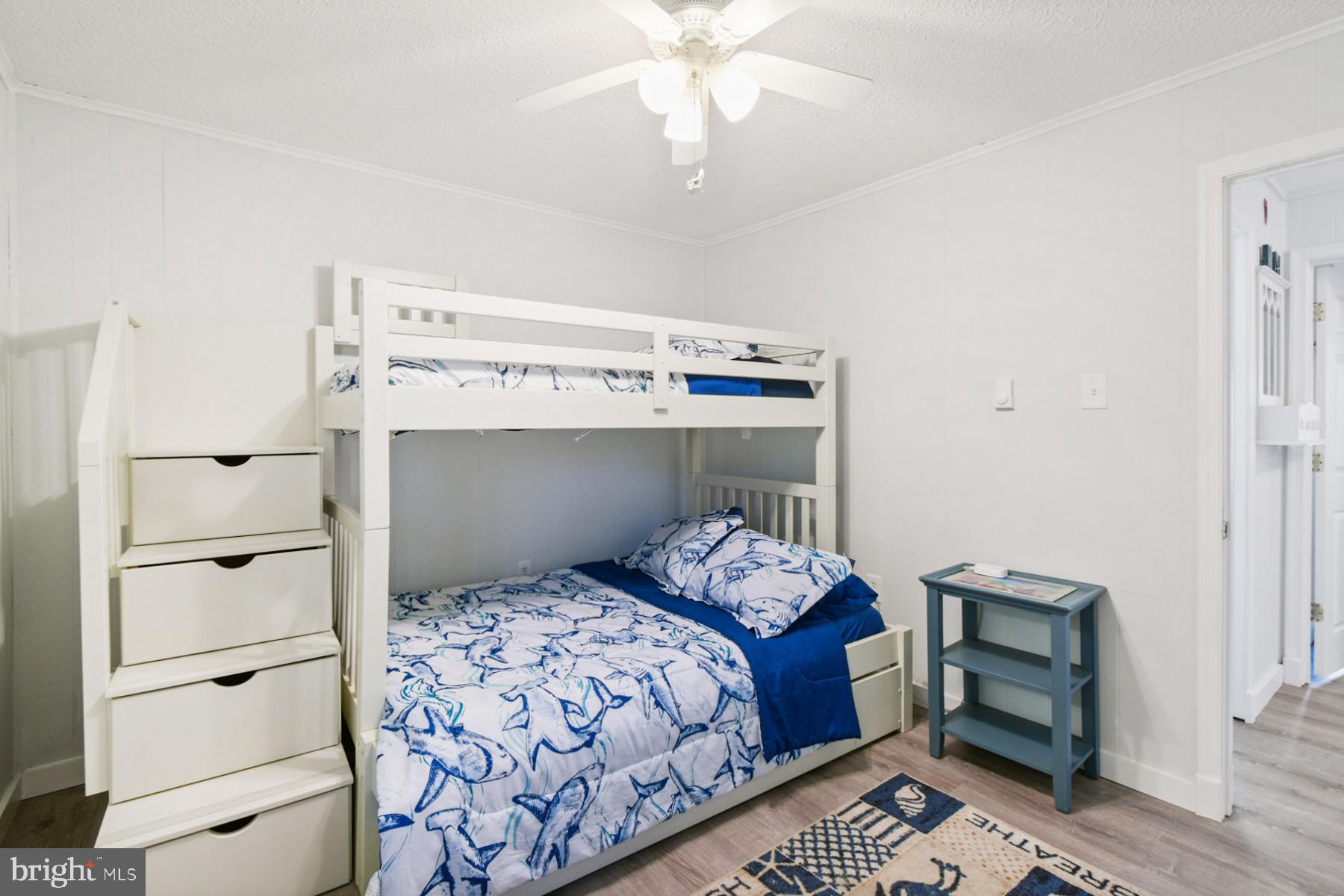 722 Mooring Road, Unit A104 Ocean City, MD 21842 - Photo 22 of 33 a bedroom with a bed and a window