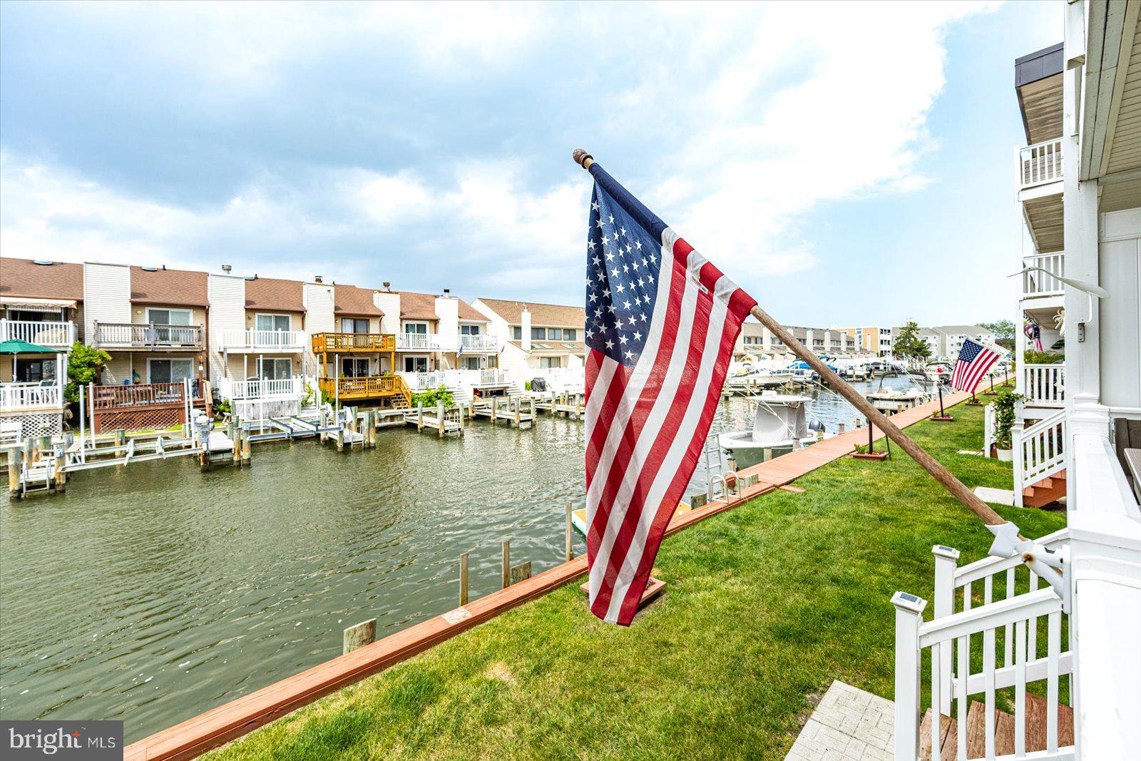 722 Mooring Road, Unit A104 Ocean City, MD 21842 - Photo 27 of 33 a view of a house with pool and windows