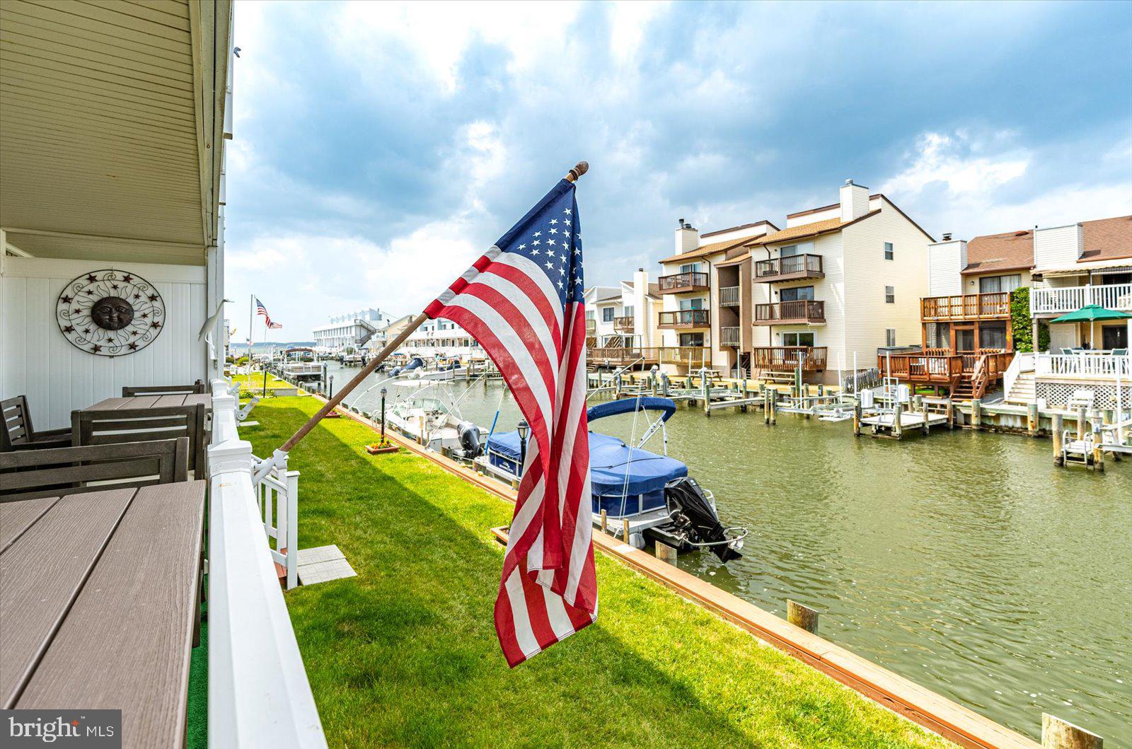 722 Mooring Road, Unit A104 Ocean City, MD 21842 - Photo 30 of 33 swimming pool with outdoor seating and yard