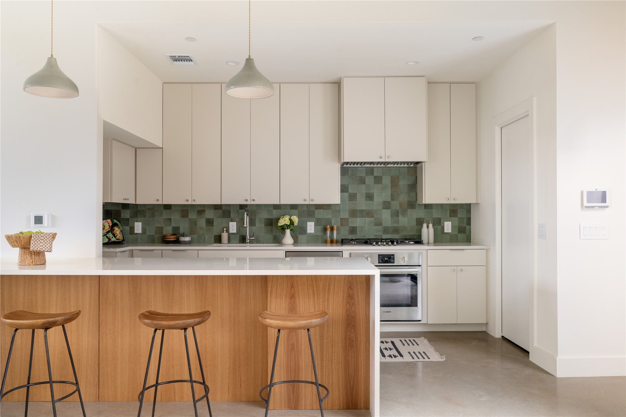 a kitchen with stainless steel appliances granite countertop white cabinets a sink and dishwasher
