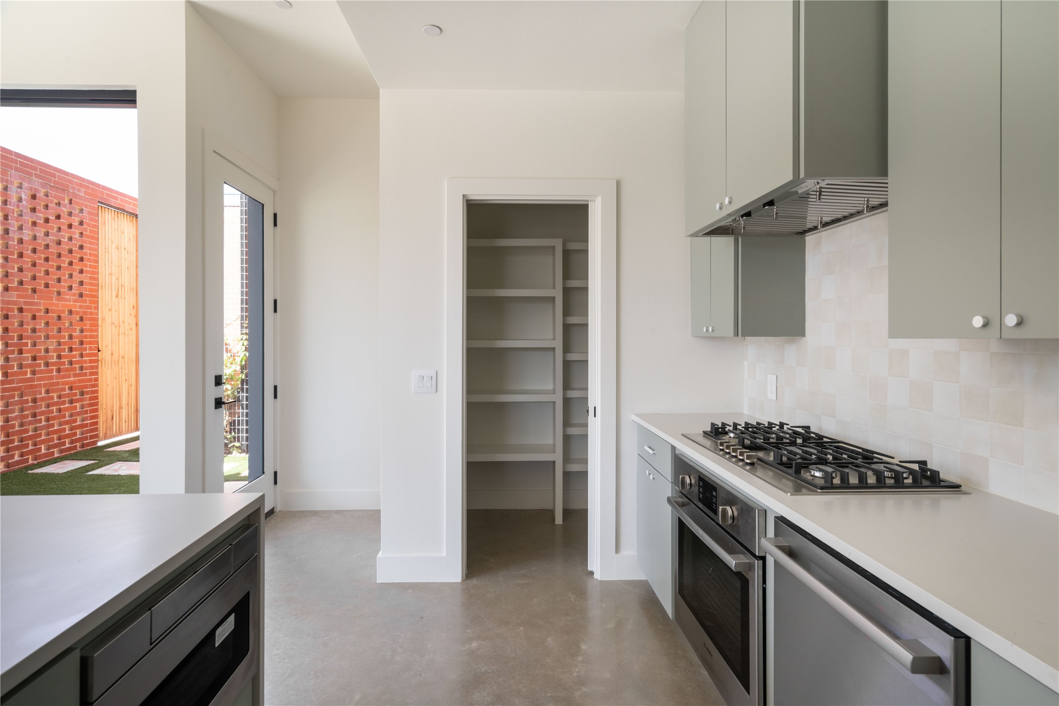 3006 Sorin Street Austin, TX 78723 - Photo 11 of 27 a kitchen with a stove and a cabinet