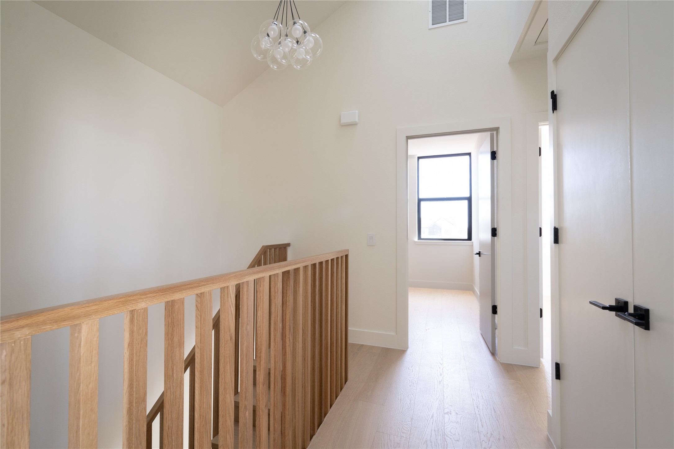 3006 Sorin Street Austin, TX 78723 - Photo 13 of 27 a view of a hallway with wooden floor